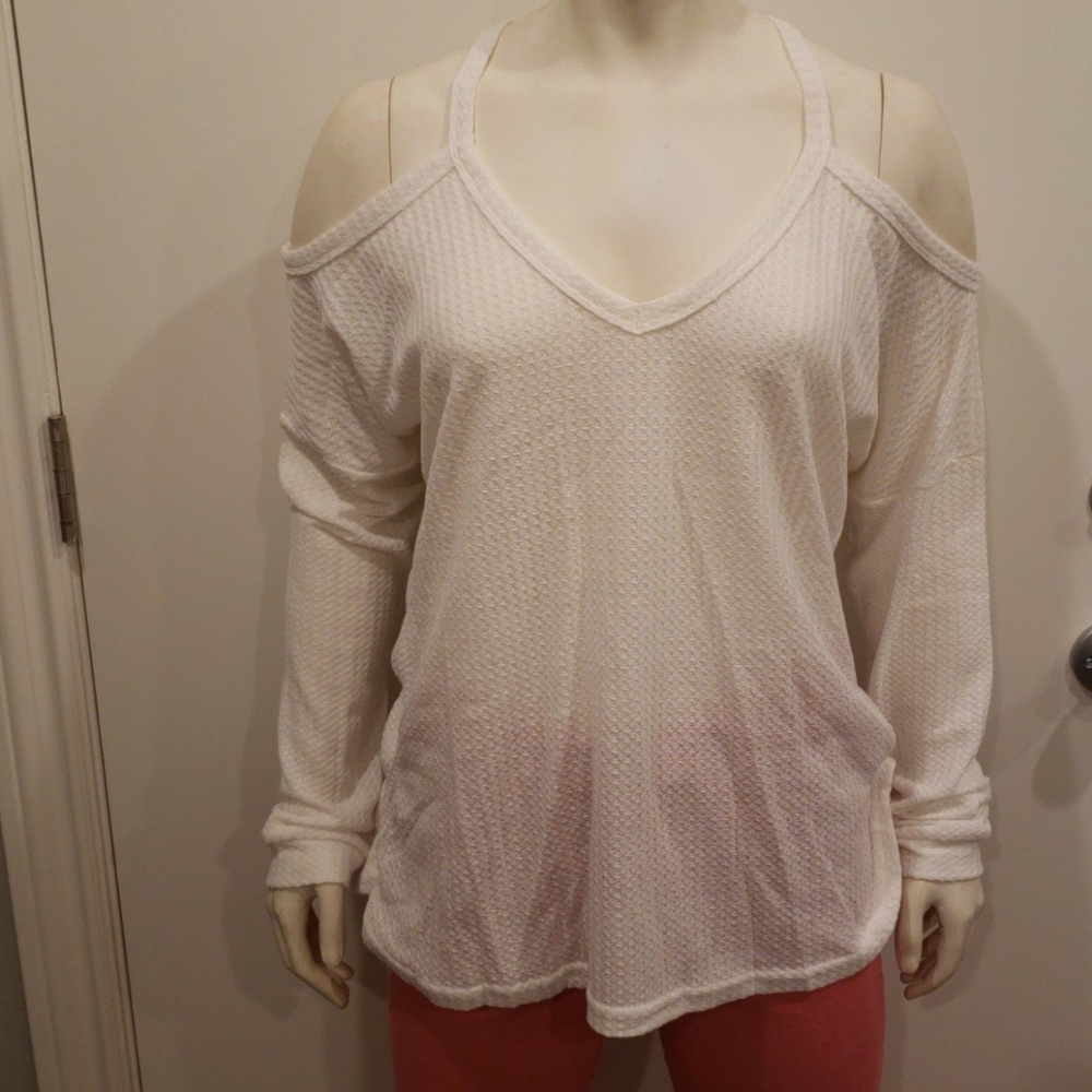 White long sleeve cold shoulder top. .